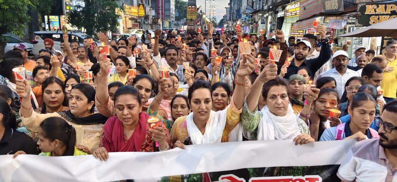 Candle march held in Ambala against paper leaks, police action